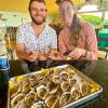 Guests enjoy local fresh Jakolaf Bay Oysters